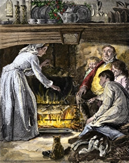 Family waiting for roast pig and a pot of food cooking for Christmas dinner