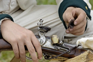 Weapon Prints: French soldier cleaning his musket at a reenactment on the Yorktown Battlefield