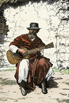 Musical Instrument Gallery: Gaucho playing his guitar, Argentina