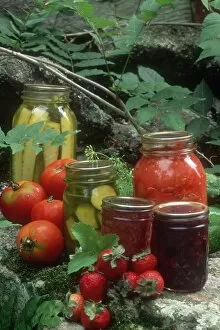 Homemade jam, pickles, and canned tomatoes