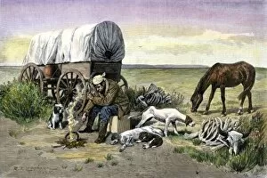 Lonely covered wagon camp on the prairie