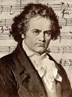 Germany Prints: Ludwig van Beethoven with one of his manuscripts