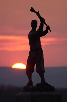 Conflict Prints: Memorial statue of a Civil War soldier on Cemetery Ridge at sunset