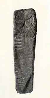 Head Stone Gallery: Ogham inscription and sun symbol on an Old Irish gravestone