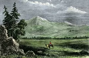 Rockies Collection: Pioneer with a pack horse in the Rockies