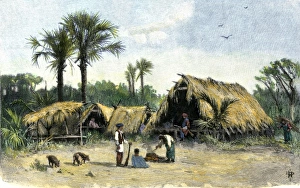 Fire Prints: Seminole village of thatched shelters in the Everglades