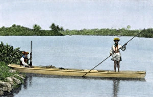 Seminole Prints: Seminoles in their dugout canoe made from a cypress log
