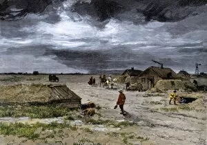 Dakota Territory Collection: Settlers preparing their prairie homestead for winter