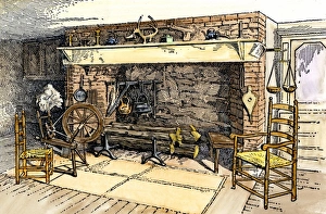 Spinning-wheel beside a colonial kitchen fireplace