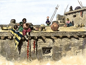 Handicraft Prints: Women decorating pottery on the roof of a Pueblo village