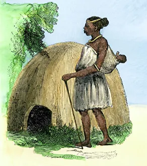 Zulu mother and child by their hut